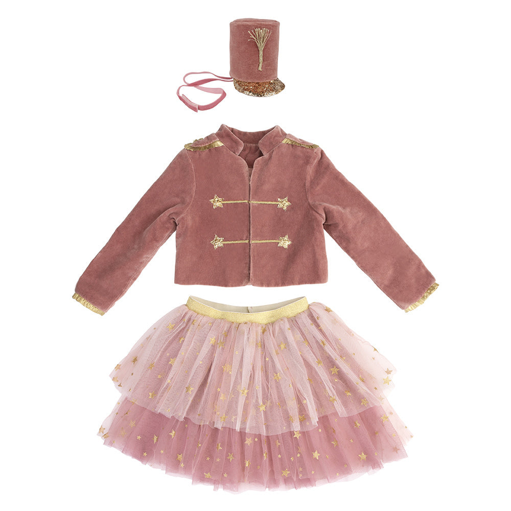 The Meri Meri Pink Soldier Costume by Meri Meri includes a velvet jacket, tulle tutu skirt with gold stars, and a matching small top hat with ribbon—ideal for imaginative play or embodying the elegance of a Nutcracker soldier.