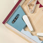 A close-up of the Coco Village Wooden Play Pinball Machine highlights metal balls, white flippers, and geometric bumpers on a light wood surface, showcasing the timeless charm of this screen-free toy.