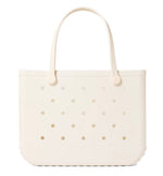 A beige, rectangular Original Bogg® Bag tote by Bogg Bags features rounded handles and small circular holes on its surface. The word “bogg” is embossed on the bottom right corner, making this washable bag ideal for use as a beach tote.