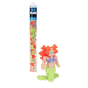 The Plus Plus Tube - Mermaid is shown beside a finished mermaid figure, encouraging creative play and helping kids develop fine motor skills with its colorful interlocking pieces.