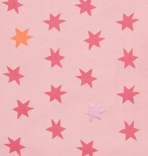 A pink background with red stars, plus one orange and one light pink star—ideal for highlighting the Magnetic Me Baby Girls' Cosmic Confetti Bow Headband, crafted from soft modal fabric.