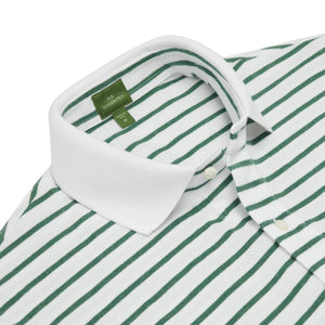 Close-up of the Sid Mashburn Court Polo—a white button-down shirt with green horizontal stripes, featuring a classic collar and an interior green label, crafted in the timeless style of a men’s polo shirt for versatile wear.