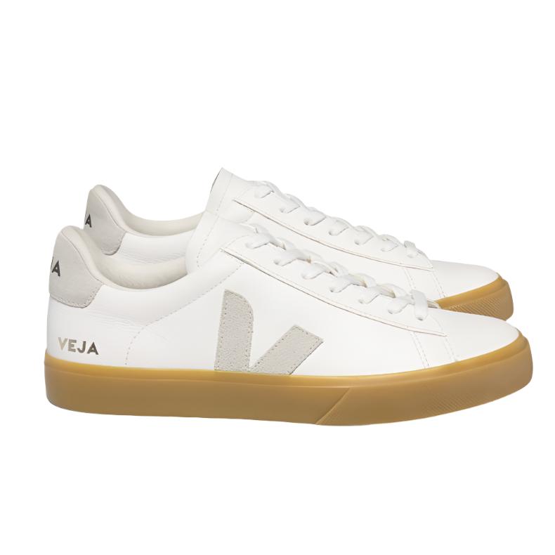 The VEJA Campo Leather Women's Sneaker by Veja boasts a stylish design with white ChromeFree leather, beige accents, and a gum sole. Featuring the "VEJA" logo on the side and heel, these sneakers are an eco-friendly choice perfect for everyday wear. Crafted in Brazil, they offer both fashion and sustainability.