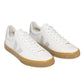 The VEJA Campo Leather Women's Sneaker by Veja is a pair of white low-top sneakers with beige accents, light brown rubber soles, and featuring ChromeFree leather, made in Brazil.