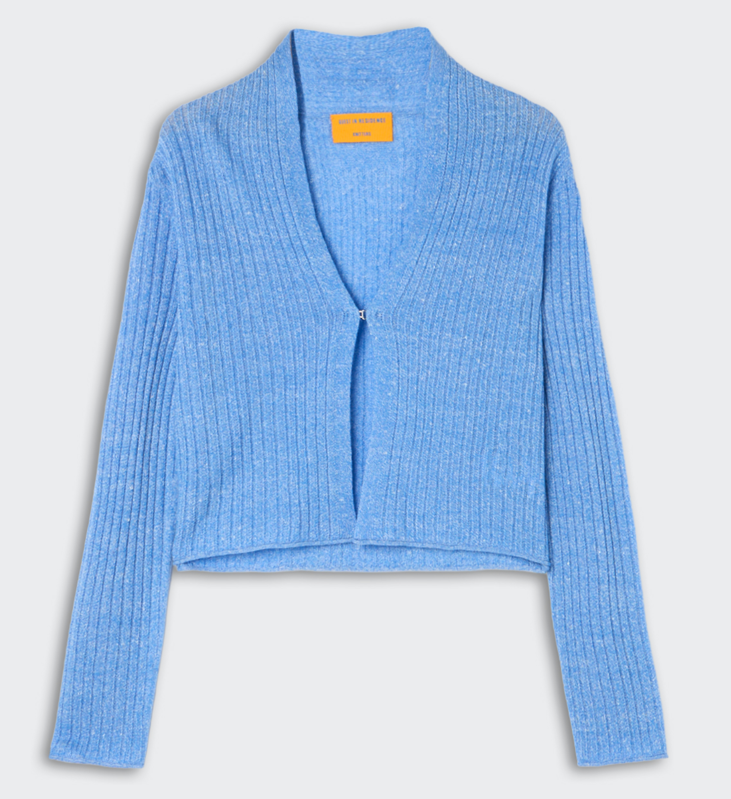The Rib Stealth Cardigan by Guest in Residence is a light blue, lightweight cashmere piece with ribbed knit, long sleeves, a cropped hem, and a single front hook closure.
