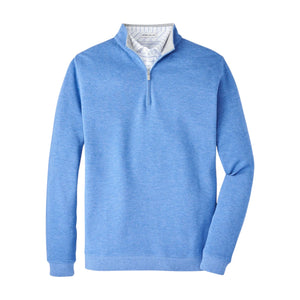 The Peter Millar Crown Comfort Pullover is a light blue quarter-zip sweatshirt made from a soft cotton-modal blend, featuring a white and blue striped inner collar, shown on a plain white background.