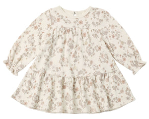 The Quincy Mae Baby Girls’ and Girls’ Tiered Jersey Dress is a long-sleeve, cream-colored dress for toddlers featuring a ruffled hem and an all-over delicate floral print in soft pink and beige tones.