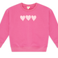 The Feather 4 Arrow Baby Girls’ and Girls’ Weekend Sweatshirt features a trendy puff print design with three light pink heart shapes across the chest.