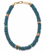 The Laguna Necklace by Lizzie Fortunato features blue recycled glass beads, gold, pink, and green Ashanti accents, and a gold hook clasp.