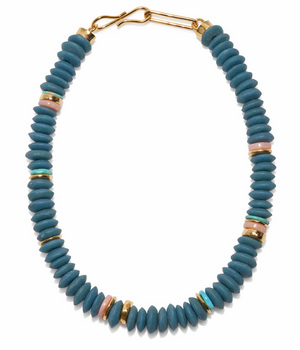 The Laguna Necklace by Lizzie Fortunato features blue recycled glass beads, gold, pink, and green Ashanti accents, and a gold hook clasp.