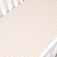 A Picnic Gingham Pink Crib Sheet from Gooselings made of OEKO-TEX certified pink and white checkered cotton sateen.