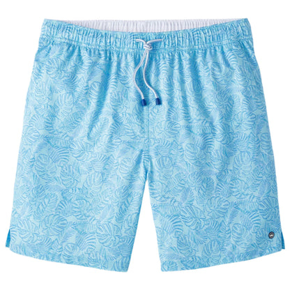 The Peter Millar Tropics Swim Trunk features a light blue color with a white drawstring and subtle palm tree print, made from four-way stretch fabric, shown laid flat on a white background.