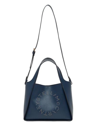 The Stella McCartney Logo Crossbody Tote Bag is crafted from vegan leather in navy blue, featuring two handles, an adjustable shoulder strap, and perforated logo detailing on the front.