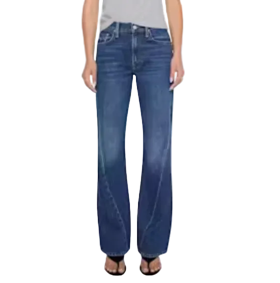 A person wearing Mother’s The Bookie Twist Skimp bootcut jeans in a light blue wash and black open-toe sandals, standing against a plain light background.