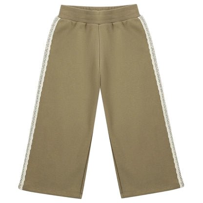 The Girls’ Wide Leg Sweat Pant by Rylee & Cru features a relaxed fit in khaki with an elastic waistband and delicate white lace trim along the sides.
