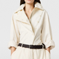 A person wears the Stella McCartney Washed Cotton Utility Top in cream with rolled-up sleeves, paired with a black woven belt and matching cream trousers.