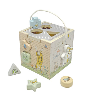 The Kids Preferred Guess How Much I Love You Wooden Shape Sorter features animal illustrations, four colorful wooden shapes, and a white carrying handle—perfect for developing fine motor skills.