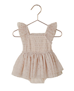 The Noralee Baby Girls' & Girls' Valentina Tutu features light pink tulle, flutter sleeves, a smocked bodice, and layered skirt, displayed on a gold hanger against a white background.