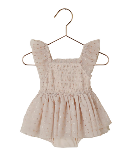 The Noralee Baby Girls' & Girls' Valentina Tutu features light pink tulle, flutter sleeves, a smocked bodice, and layered skirt, displayed on a gold hanger against a white background.