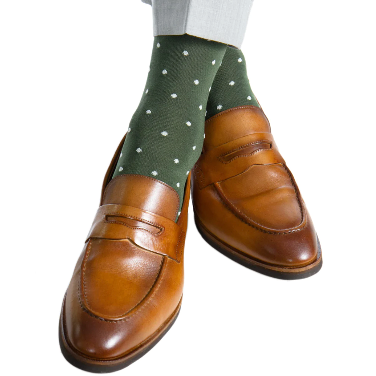 Brown leather penny loafers, complemented by Dapper Classics Dot Mid Calf Socks in forest green featuring cream dots, crafted from luxurious mercerized cotton.