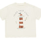 The Rylee & Cru Baby Boys' & Boys' Relaxed Tee is an off-white cotton jersey featuring a red and white striped lighthouse, two seagulls, and “Shine Your Light” above the design. Available in baby sizes.