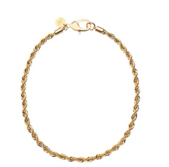 The Jane Win Necklace Chain Collection features a gold rope chain bracelet with a lobster clasp and a small round tag near the clasp—an elegant piece displayed on white that complements any versatile jewelry collection.