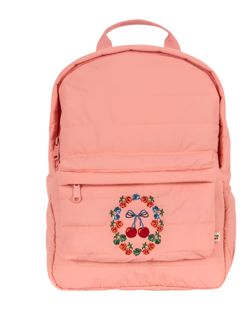 The Konges Slojd Juno Quilted Backpack is light pink with a front pocket and bottle pocket, featuring embroidered cherries surrounded by colorful flowers.