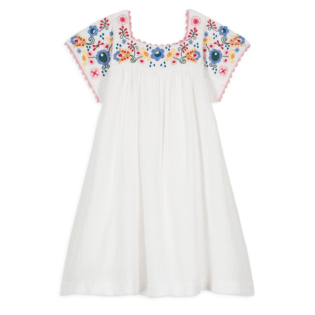 The Girls' Daya Dress by Louise Misha features a white cotton gauze fabric with vibrant floral embroidery on the sleeves and neckline.