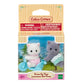 The Calico Critters Persian Cat Twins set includes two adorable small cat figures with soft, fluffy fur and a charming blue tricycle. Suitable for ages 3 and up; choking hazard warning applies.