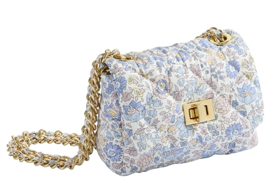 Milledeux Small Chain Bag in Liberty Print with gold chain strap and quilted flap closure on a white background.