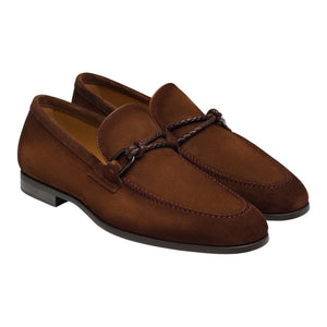 The Magnanni Destin Cognac Suede loafers, featuring a braided strap and low heels, are displayed side by side against a white background.