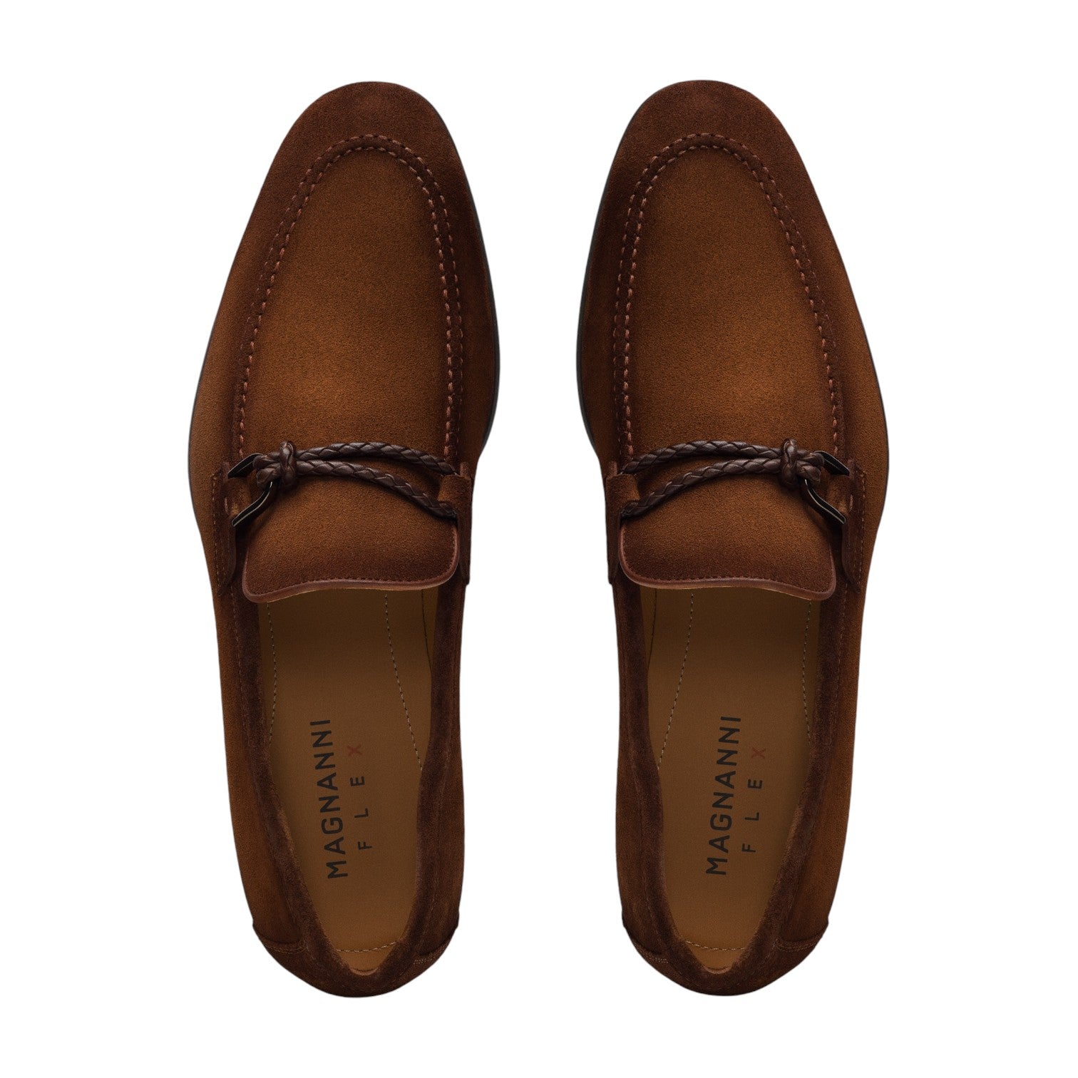 A pair of Magnanni Destin Cognac Suede men's contemporary loafers, featuring a braided strap detail, viewed from above.