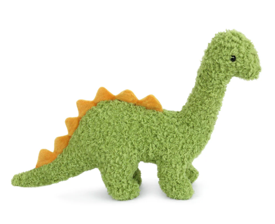 The Mon Ami Brody Brontosaurus is a green plush toy with a long neck, four legs, and orange felt spikes along its back. Made from recycled materials, it’s displayed on a white background.