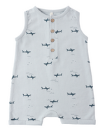 The Rylee & Cru Baby Boys' Davis Romper is a sleeveless light blue coastal piece featuring playful sharks, three wooden chest buttons, and a round neckline.
