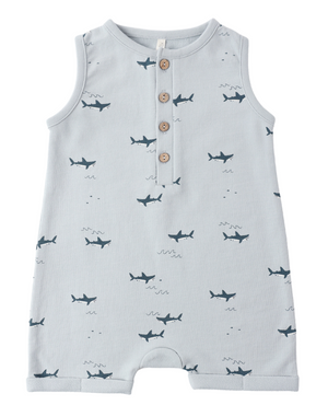 The Rylee & Cru Baby Boys' Davis Romper is a sleeveless light blue coastal piece featuring playful sharks, three wooden chest buttons, and a round neckline.