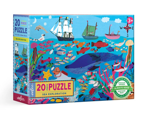 The Eeboo Sea Exploration 20-Piece Puzzle is a colorful kids’ puzzle for ages 3+, featuring ships, ocean animals, and coral; eco-friendly and woman-owned business badges are displayed on the box.