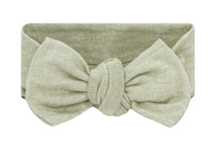 Lou Lou & Company Baby Girls’ Collins Plush Knit Headband in light green features a large, knotted bow at the front, making it a charming hair accessory for toddlers, shown against a white background.