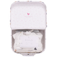 The Nesting Box Baby Take Home Set by Pink Chicken features an open suitcase with a chicken pattern, folded organic pima cotton fabric, and a card—making it a perfect newborn gift.
