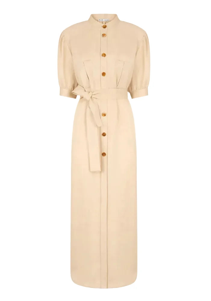 The Donzi Berber Long Dress by Blaze Milano is a beige, safari-inspired long dress featuring short sleeves, a mandarin collar, front buttons, a fitted waist tie belt, and two chest pockets.
