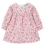 The Tartine et Chocolat Girls’ Floral Print Cotton Dress features a soft unbleached cotton fabric with a pink floral print on a white background, designed with long sleeves, a round neckline, and a gathered waist.