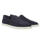 A pair of vince Sonoma Woven Suede Loafers in navy blue, featuring white rubber soles, are positioned side by side on a plain white background. These casual loafers offer a stylish addition to any men’s footwear collection.