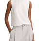 A person wears the Vince Linen Crew Neck Shell Tank and high-waisted light gray linen-blend trousers with a belt, standing with one hand in a pocket.