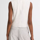A person is shown from the back against a white background wearing the vince Linen Crew Neck Shell Tank with light gray pants, highlighting its breathable linen-blend fabric.
