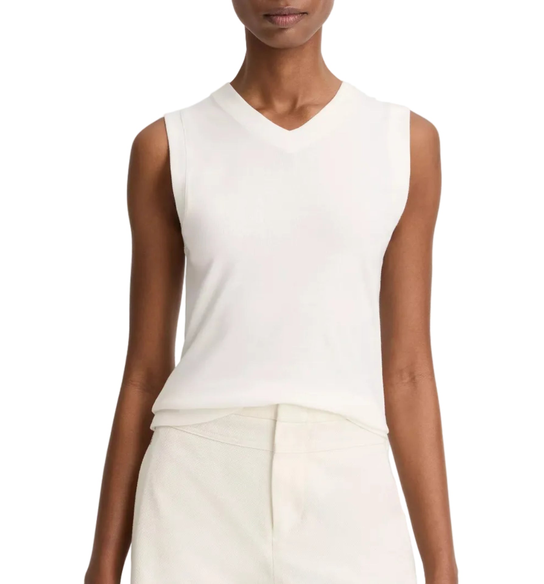 A person wears the vince High V-Neck Shell Tank, a sleeveless white top, tucked into high-waisted off-white pants; shown from shoulders to hips.