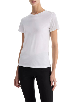 A person wearing the Vince Essential Crew plain white short-sleeve T-shirt crafted from Peruvian Pima cotton and black pants stands against a white background.