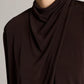 A person wears the vince Long Sleeve Draped Cowl Blouse in black matte jersey; only the lower half of their face and upper torso are shown against a neutral background, emphasizing the blouse’s elegant, versatile silhouette.