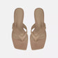 A pair of Vince San Juan Leather Thong Sandals in beige, featuring square toes, heeled design, leather straps, and a padded footbed, displayed from above on a plain white background.