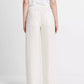 Model wears a white t-shirt and vince Hemp Utility Pant, featuring a relaxed silhouette and breathable fabric, shown from the back against a plain white background.