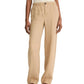 A person wearing vince Hemp Utility Pants in beige with a relaxed, wide-leg fit and elastic waist, styled with a white sleeveless top and brown sandals for a breezy summer look.