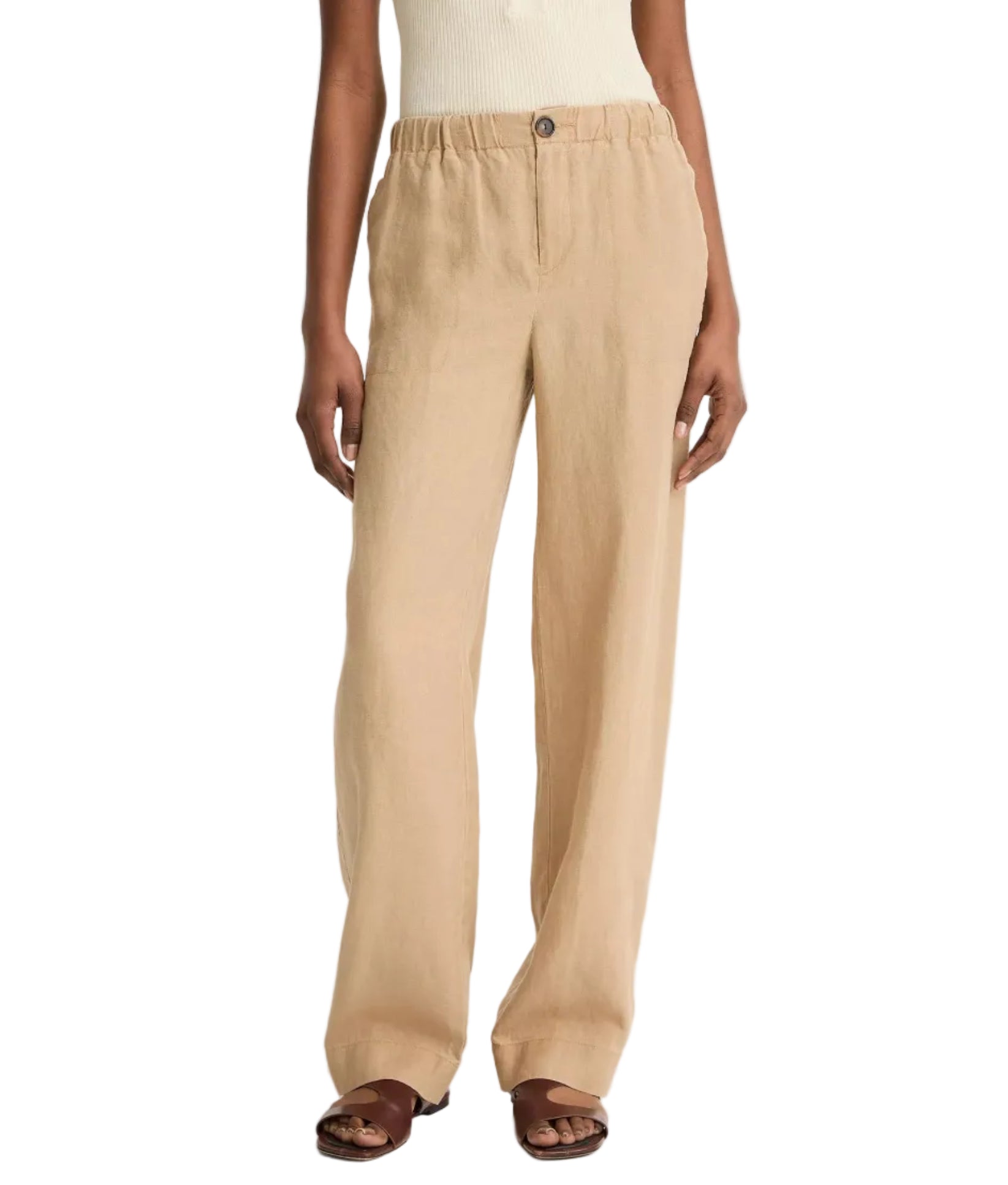 A person wearing vince Hemp Utility Pants in beige with a relaxed, wide-leg fit and elastic waist, styled with a white sleeveless top and brown sandals for a breezy summer look.